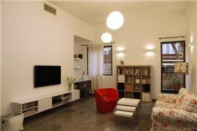סלון מודרני בדירה תל אביבית בעיצוב ותכנון זוהר רוזנפלד